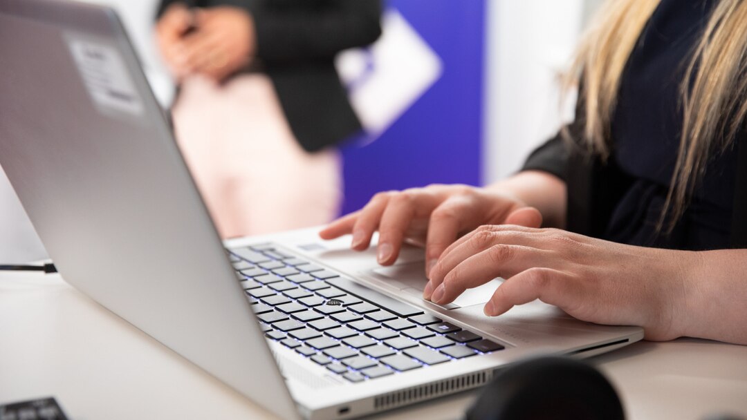 Woman Typing On Computer